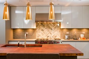 With its earthy tones, basic structure, and freedom of space, this modern kitchen design offers a good balance of masculine and feminine accents to meet the needs of any person or family.